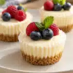Classic No-Bake Mini Cheesecakes 4 Classic No-bake mini cheesecakes with graham cracker crust and fresh berries