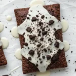 Homemade cookies and cream pop tarts with vanilla glaze and cookie crumbs