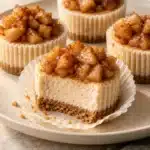 Mini Apple Cinnamon Cheesecakes 2 Mini Apple Cinnamon Cheesecakes with graham crust and glossy diced apple topping