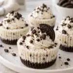 No-Bake Oreo Mini Cheesecakes 11 No-Bake Oreo Mini Cheesecakes with cookie crumb crust and whipped cream