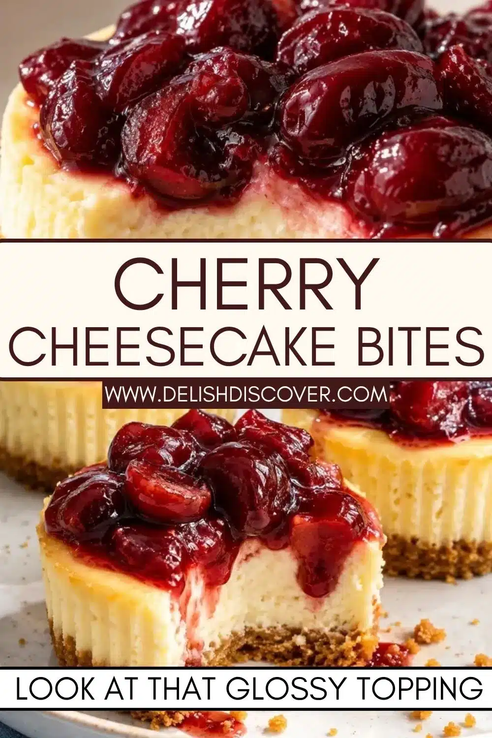 A cut-open mini cheesecake covered with glossy dark cherries, showing the creamy filling and golden crumb crust.