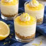 No-Bake Lemon Cheesecake Shooters 11 Lemon cheesecake shooters with golden graham crumbs, creamy filling and a thin yellow lemon curd topping